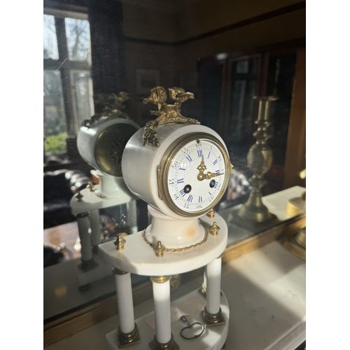 152 - 19th C. French marble clock with ormolu mounts and enamel dial. {37 cm H x 20 cm W x 10 cm D].