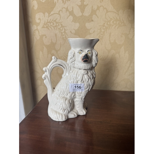 156 - Pair of 19th C. Staffordshire water jugs in the form of Dogs. {20 cm H x 15 cm W x 8 cm D}.