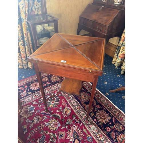 166 - Edwardian mahogany and inlaid satinwood envelope card table raised on square tapered legs. {77 cm H ... 