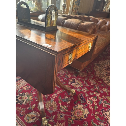 168 - Regency mahogany and ebonised sofa table, raised on turned column and four outswept feet. {70 cm H x... 