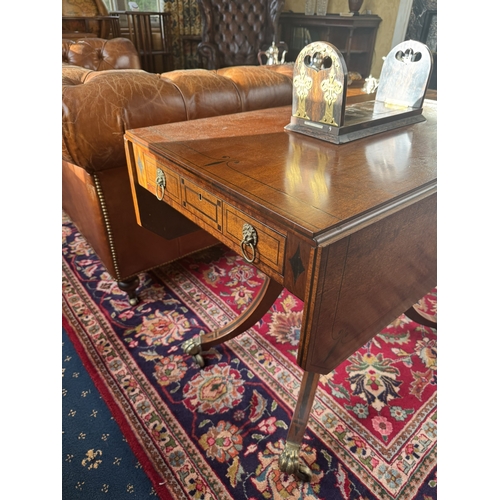 168 - Regency mahogany and ebonised sofa table, raised on turned column and four outswept feet. {70 cm H x... 