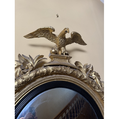 177 - 19th C. Irish Giltwood convex mirrror surmounted by eagle flanked by sconces and decorated with ivy ... 