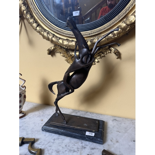 179 - Bronze Horse and Rider mounted  on marble plinth in the manner of Salvador Dali. {53 cm H x 36 cm W ... 