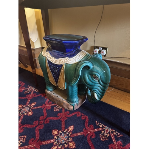 189 - Pair of glazed terracotta garden stools in the form of Elephants. {54 cm H x 66 cm W x 26 cm D}.