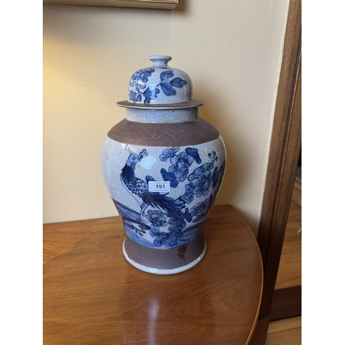 191 - Pair of blue and white Oriental lidded vases decorated with birds and foliage. {46 cm H x 27 cm Dia}... 