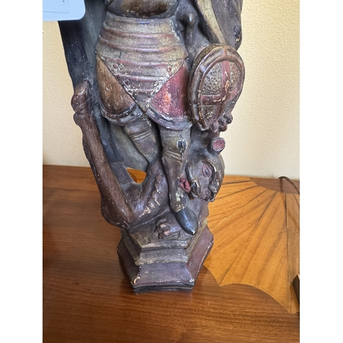 195 - Resin statue of St Michael. {44 cm H x 20 cm W  x 9 cm D}.