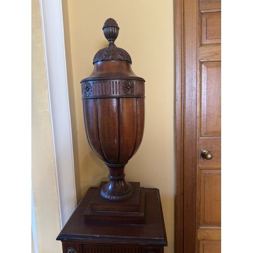 196 - Pair of carved mahogany urns, raised on pedestals in the Chippendale manner. {190 cm H x 41 cm W x 4... 