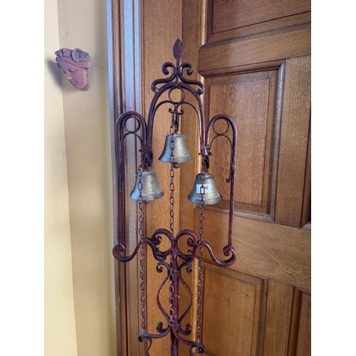 199 - Unusual decorative wrought iron house bell, raised on single column with tripod base. {176 cm H x 50... 