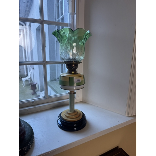 200 - Edwardian ceramic and glass oil lamp with green glass shade. {63 cm H x 21 cm Dia.}.