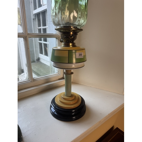 200 - Edwardian ceramic and glass oil lamp with green glass shade. {63 cm H x 21 cm Dia.}.