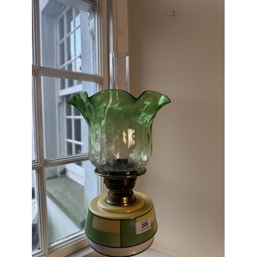 200 - Edwardian ceramic and glass oil lamp with green glass shade. {63 cm H x 21 cm Dia.}.