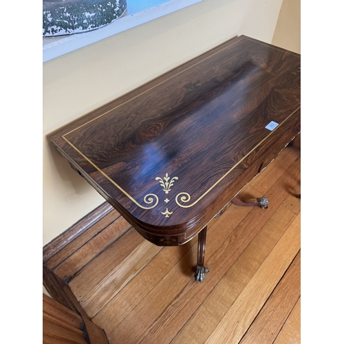 202 - Good quality brass and inlaid rosewood card table, raised on turned column and four outswept feet. {... 