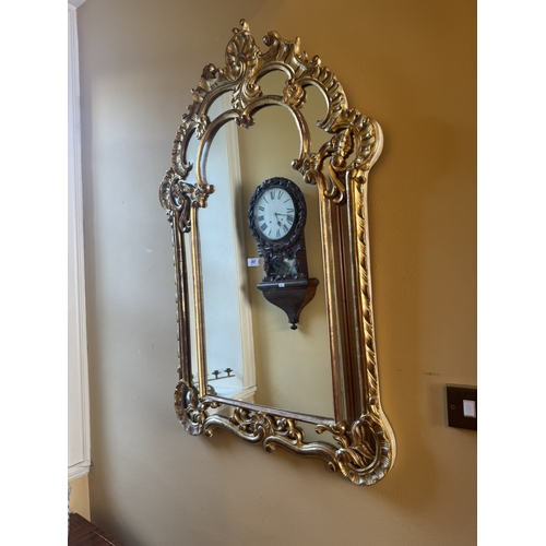 207 - Early 20th C. Italian giltwood wall mirror. {117 cm H x 76 cm W}.