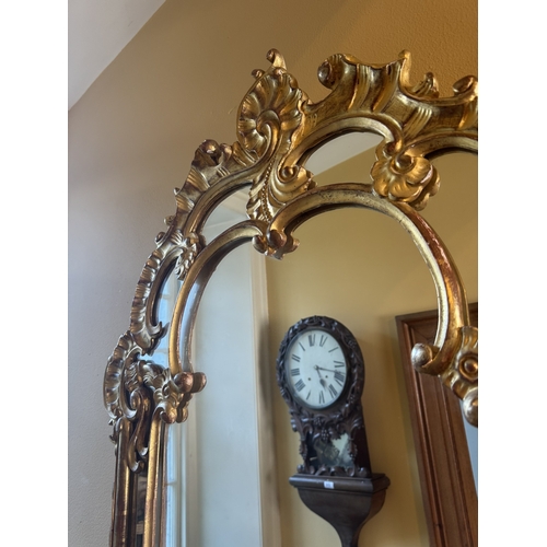 207 - Early 20th C. Italian giltwood wall mirror. {117 cm H x 76 cm W}.