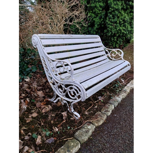 21 - Decorative cast iron garden bench with wooden laths. {87 cm H x 135 cm W x 83 cm D}.