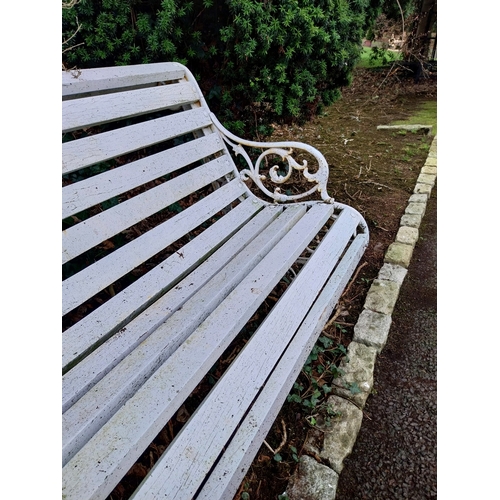 21 - Decorative cast iron garden bench with wooden laths. {87 cm H x 135 cm W x 83 cm D}.