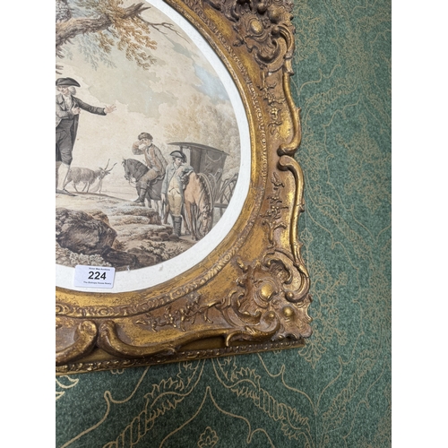 224 - Coloured print of Carriage and Woodland scene mounted in gilt frame. {54 cm H x 55 cm W}.