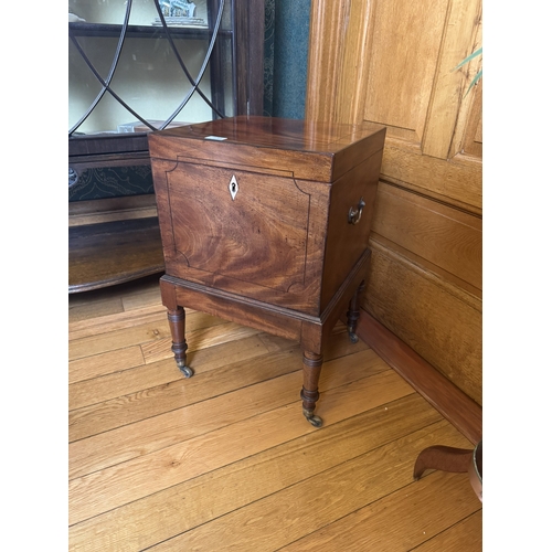 234 - Regency mahogany and ebonised wine cellarette, raised on turned legs and brass casters. {62 cm H x 4... 