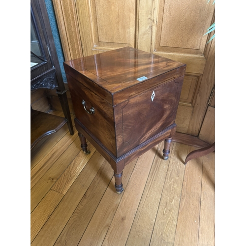 234 - Regency mahogany and ebonised wine cellarette, raised on turned legs and brass casters. {62 cm H x 4... 