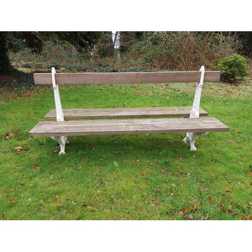 24 - Decorative cast iron railway bench with wooden seats. {100 cm H x 200 cm W x 76 cm D}.