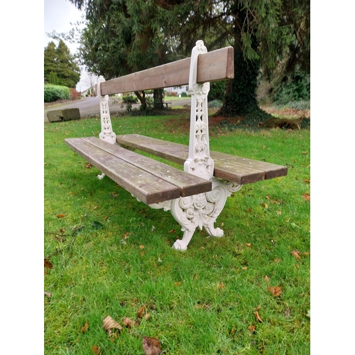 24 - Decorative cast iron railway bench with wooden seats. {100 cm H x 200 cm W x 76 cm D}.