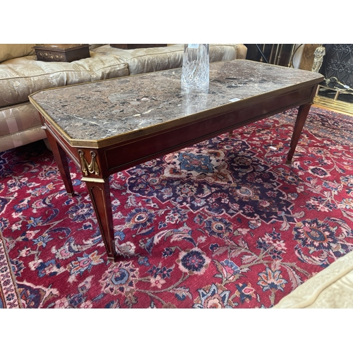 250 - Edwardian French mahogany coffee table with marble top and ormolu mounts, raised on tapered legs {47... 