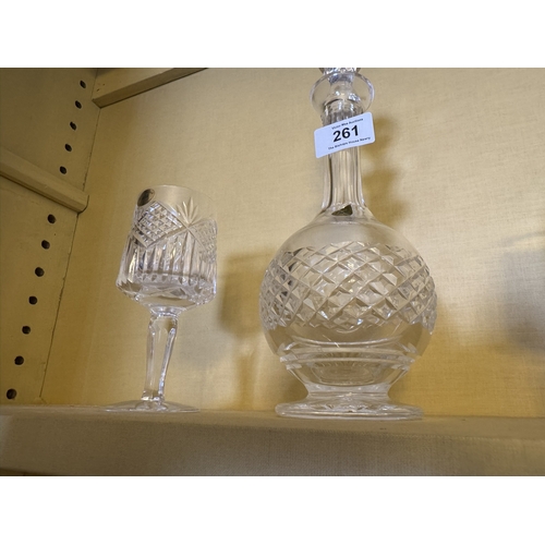 261 - Tyrone crystal decanter {27 cm H x 10 cm Dia} and two wine glasses {15 cm H x 8 cm Dia.}.