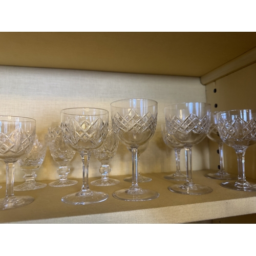 262 - Two shelves of miscellaneous cut crstal glasses.