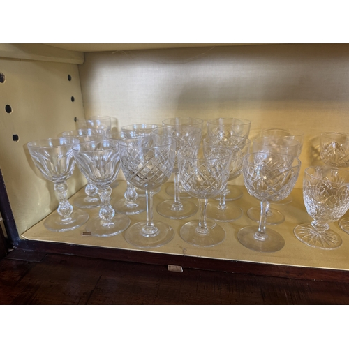 263 - Two shelves of miscellaneous cut crystal glasses.