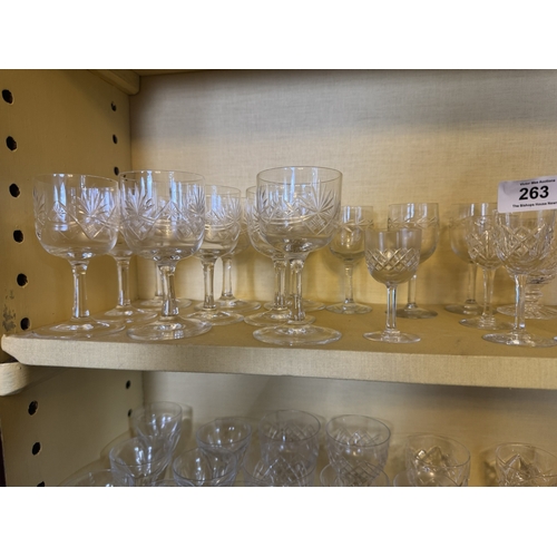 263 - Two shelves of miscellaneous cut crystal glasses.