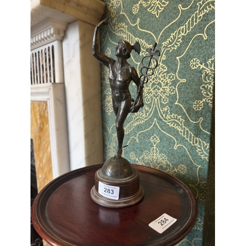 283 - Early 20th C. Bronze spelter figure of Mercury, raised on mahogany stand. {29 cm H x 11 cm W x 12 cm... 