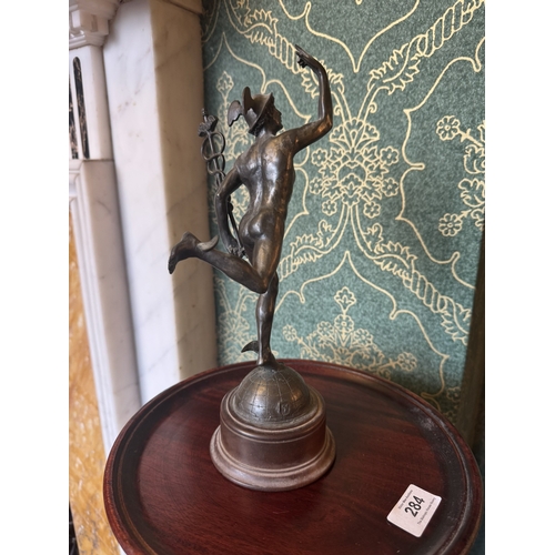 283 - Early 20th C. Bronze spelter figure of Mercury, raised on mahogany stand. {29 cm H x 11 cm W x 12 cm... 