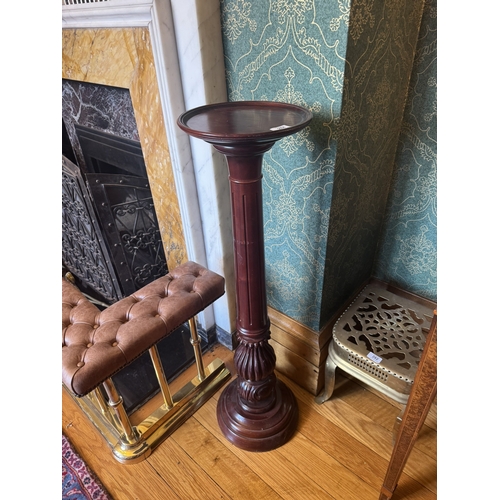 284 - Pair of carved mahogany torcheres in the William IV manner. {102 cm H x 28 cm Dia.}.