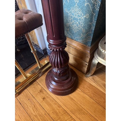 284 - Pair of carved mahogany torcheres in the William IV manner. {102 cm H x 28 cm Dia.}.