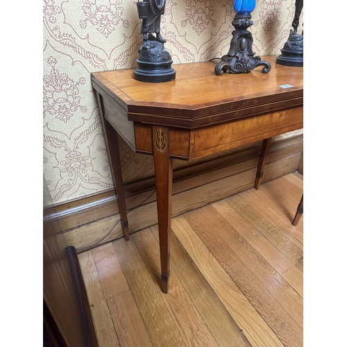 301 - 19th C. Satinwood crossbanded turn over leaf card table, raised on square tapered legs. {76 cm H x 9... 