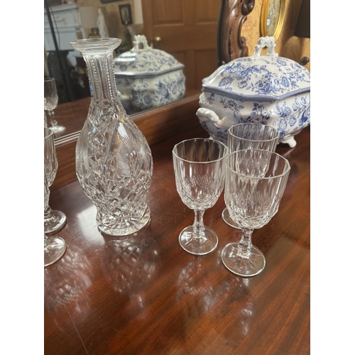 309 - Six moulded glass wine glasses and cut crystal decanter. {16 cm H} and {28 cm H}.