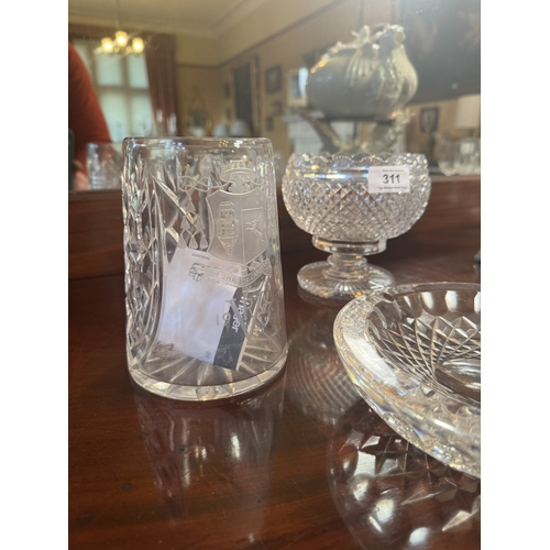 311 - Two cut crystal vases  and bowl. {15 cm H , 13 cm H and 5 cm H}.