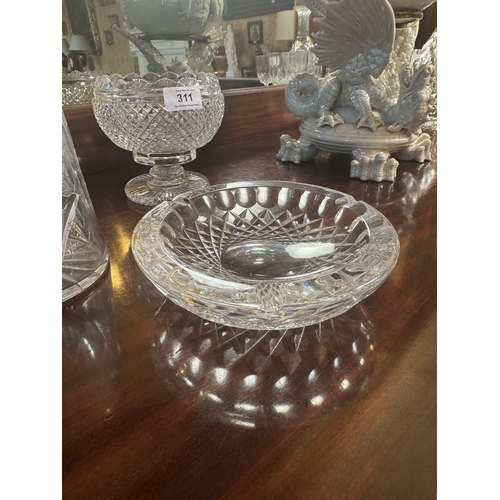 311 - Two cut crystal vases  and bowl. {15 cm H , 13 cm H and 5 cm H}.