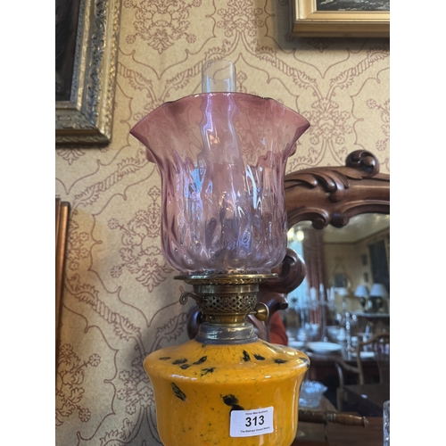 313 - Edwardian brass oil lamp with ruby glass shade. {67 cm H x 21 cm Dia.}.