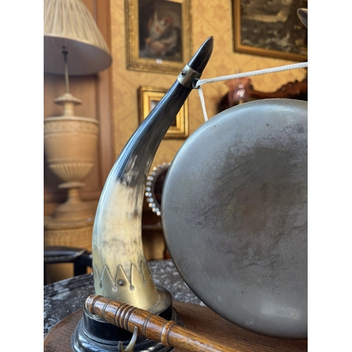 323 - Early 20th C. dinner gong made from cow horns and silver plate mounts, mounted on oak plinth {33 cm ... 