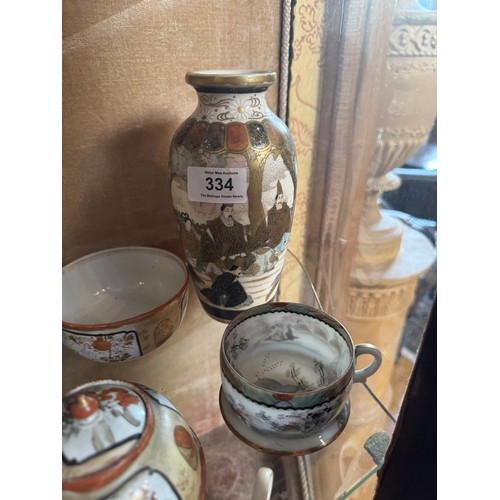 334 - 19th C. Oriental ceramic vase and two cups. {18 cm H to 5 cm H}