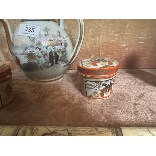 335 - Early 20th C. Oriental Hand painted tea pot and two lidded bowls. {19 cm H to 6 cm H}.