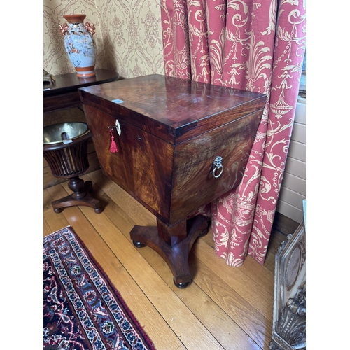 350 - Georgian flamed mahogany cellarette with fitted interior, raised on square column and platform base ... 