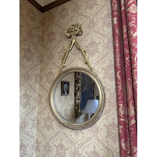 353 - Pair of Regency giltwood mirrors decorated with ribbons. {108 cm H x 60 cm W}.