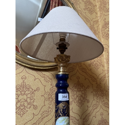 354 - Pair of decorative French hand painted ceramic lamps with cloth shades. {104 cm H x 34 cm Dia}.