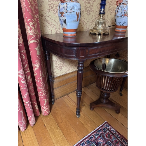 356 - Regency mahogany side table,raised on turned legs and brass castors. {72 cm H x 90 cm W x 45 cm D}