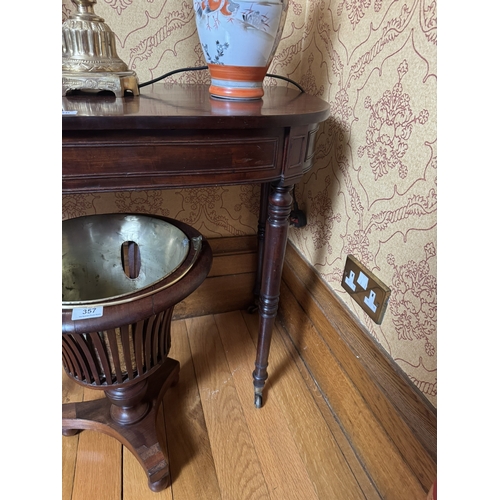 356 - Regency mahogany side table,raised on turned legs and brass castors. {72 cm H x 90 cm W x 45 cm D}