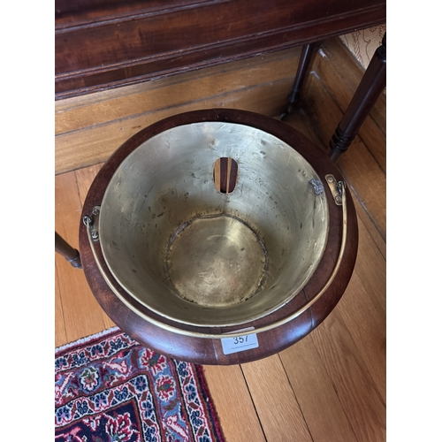 357 - 19th C. Mahogany wine cooler with brass liner and handles. {51 cm H x 37 cm Dia.}.