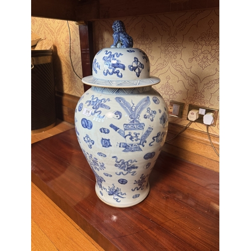 375 - Large pair of blue and white oriental ceramic lidded jars. {66 cm H x 33 cm Dia.}