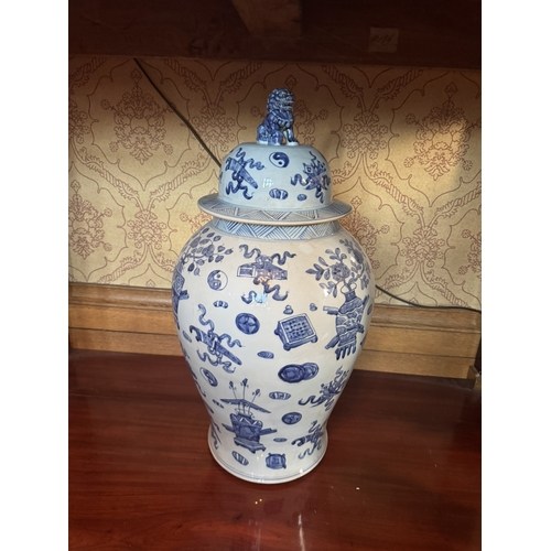 375 - Large pair of blue and white oriental ceramic lidded jars. {66 cm H x 33 cm Dia.}